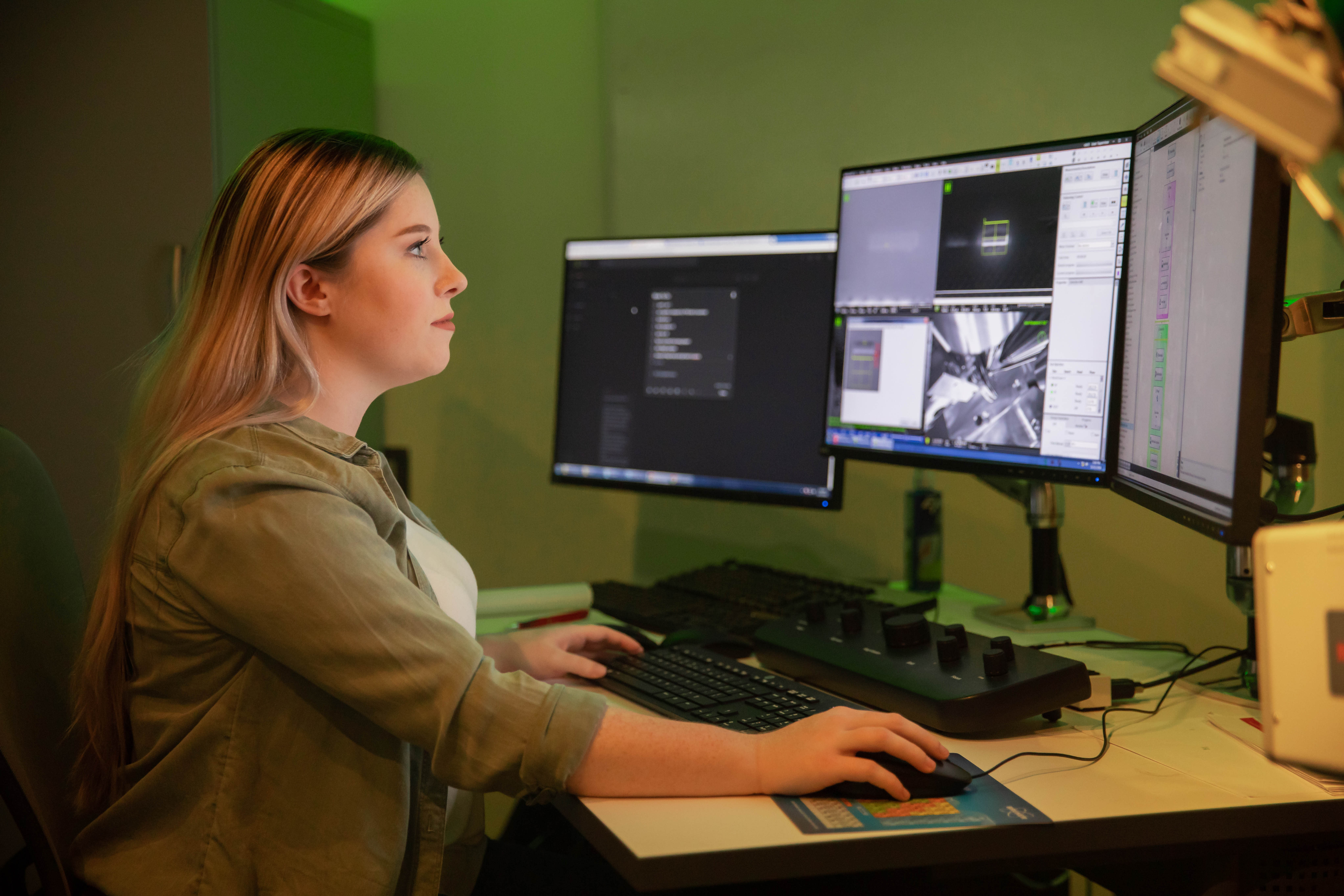 Woman sitting and looking at computer.